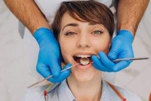 female-patient-sitting-dentist-chair-making-professinal-hygiene_1303-26389