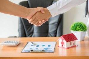 hands-agent-client-shaking-hands-after-signed-contract-buy-new-apartment_1150-14836-1