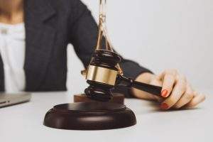 woman-notary-with-wooden-gavel-isolated_253401-1376