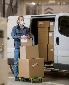 man with boxes and mask